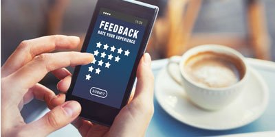 providing feedback on the mobile phone online | review generation and social media integration of websites by ABS web design company in bangalore