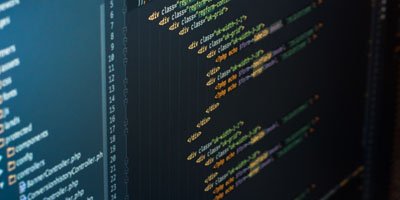 multiple lines of code on a laptop screen | web design and development company in bangalore india